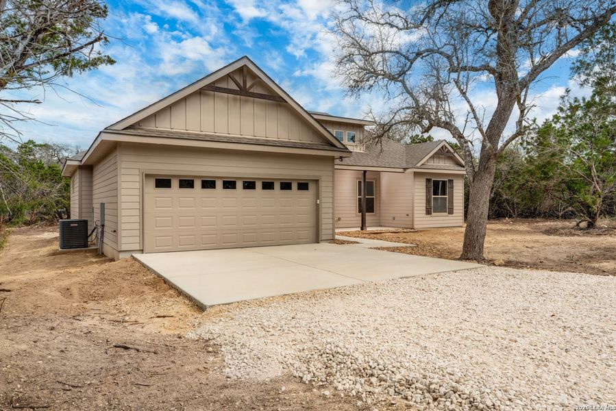 Front exterior of a new home in , Bandera, TX, highlighting curb appeal (Image 23). Front exterior of a new home in , Bandera, TX, highlighting curb appeal (Image 23).