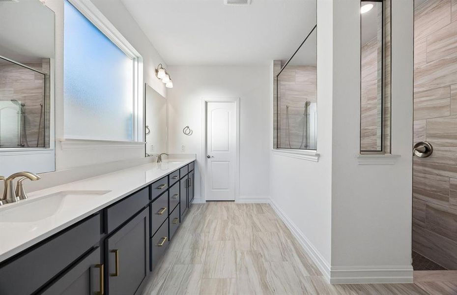 Spacious owner's bath with large, walk-in shower Spacious owner's bath with large, walk-in shower