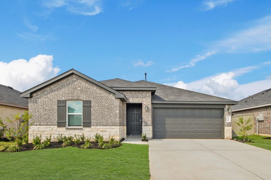 Front exterior of a new home in Harrington Trails at The Canopies, Splendora, TX, highlighting curb appeal (Image 2). Front exterior of a new home in Harrington Trails at The Canopies, Splendora, TX, highlighting curb appeal (Image 2).