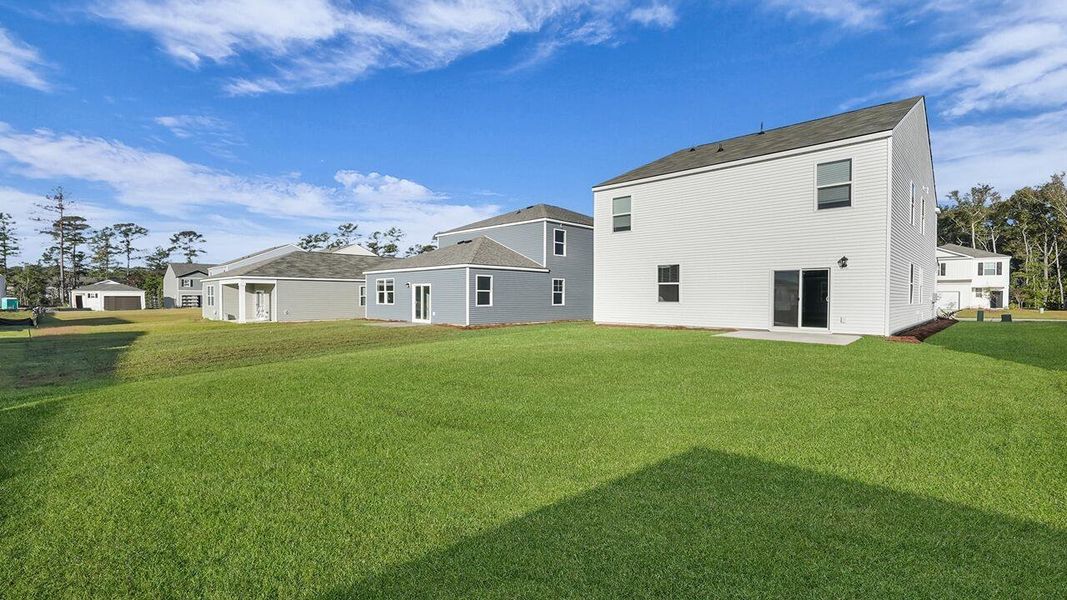 Exterior details and patio area of a home in Pine Hills at Cane Bay, Summerville (Image 19).