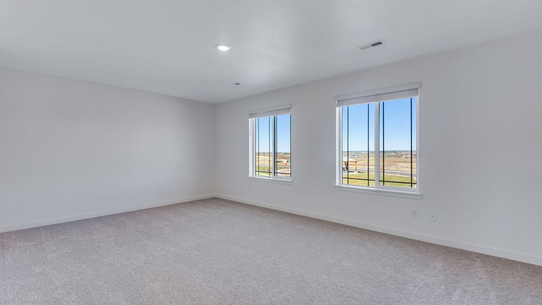 Spacious, unfurnished interior of a new home in Trails at Crowfoot, Parker (Image 21).