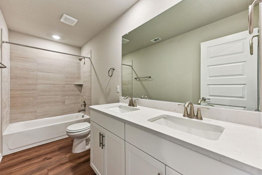Full bathroom upstairs with dual vanity