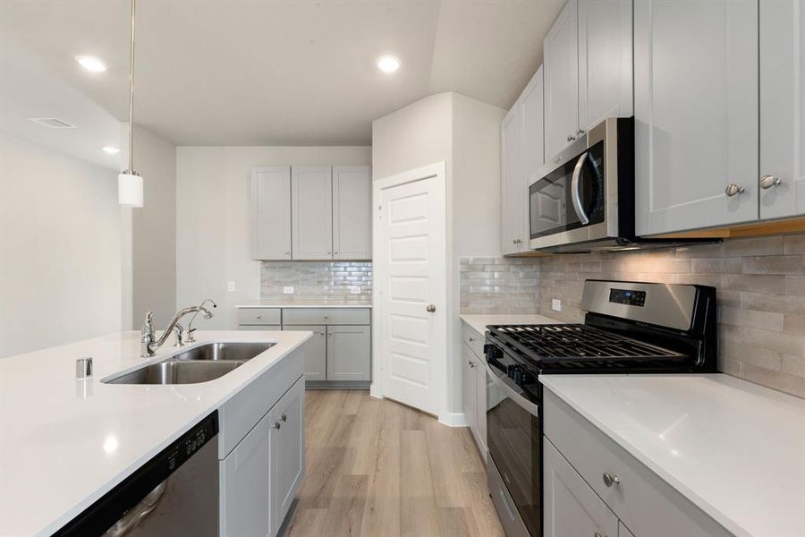 This stunning kitchen is perfect for everyday life as well as entertaining family and friends! Extra large kitchen island is perfect for conversation or that much needed space to lay out your party spread for everyone to enjoy!