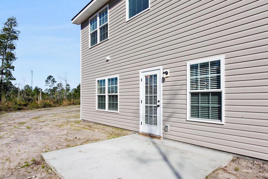 Representative exterior photo of a completed home built from the The Stacy by RTS Homes in Grand Reserve, Hinesville, GA (Image 23).