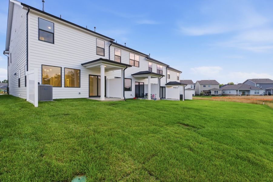 Exterior details and patio area of a home in Nexus Townhomes, Gallatin (Image 3).