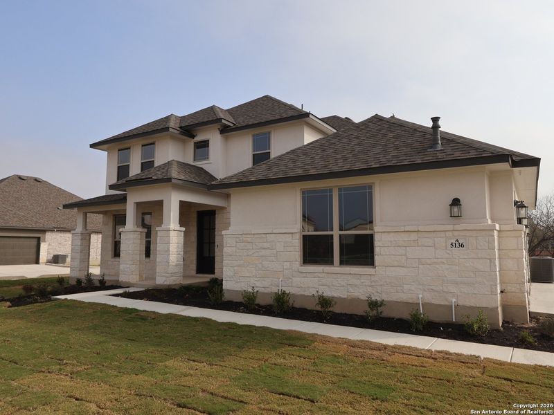 Front exterior of a new home in Everly Estates, San Antonio, TX, highlighting curb appeal (Image 13).