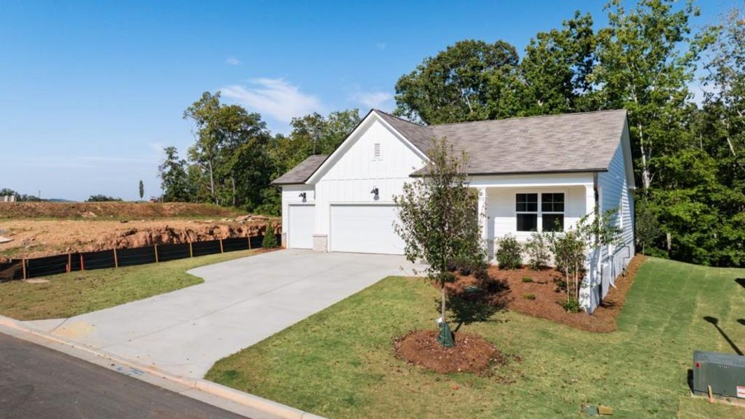 Front exterior of a new home in Falcon Landing, Gainesville, GA, highlighting curb appeal (Image 17).