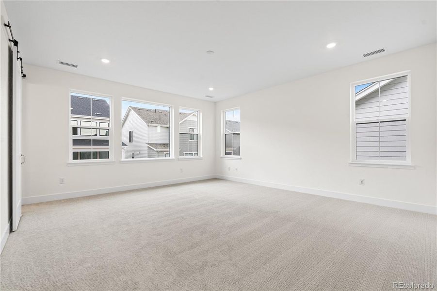 Spacious, unfurnished interior of a new home in Stargaze at Solstice, Littleton (Image 40).