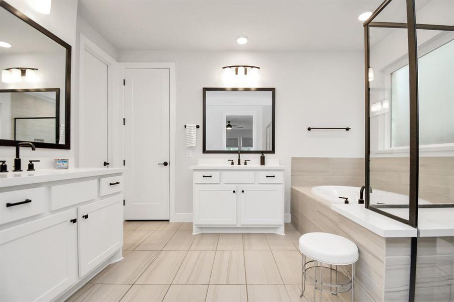 Modern beautiful spacious primary Bathroom with separate sinks.