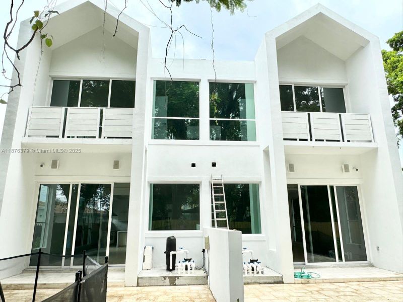 Front exterior of a new home in , Miami, FL, highlighting curb appeal (Image 13).