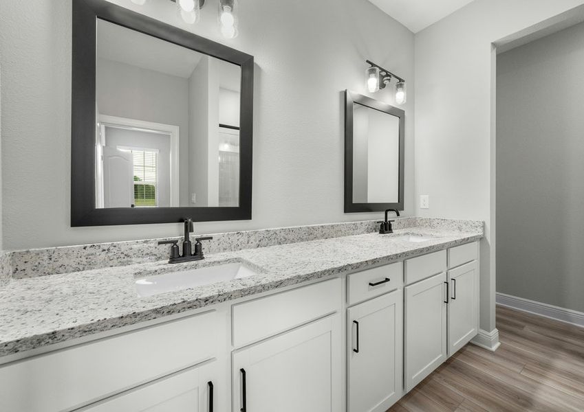 Master bathroom dual sink vanity and framed mirrors