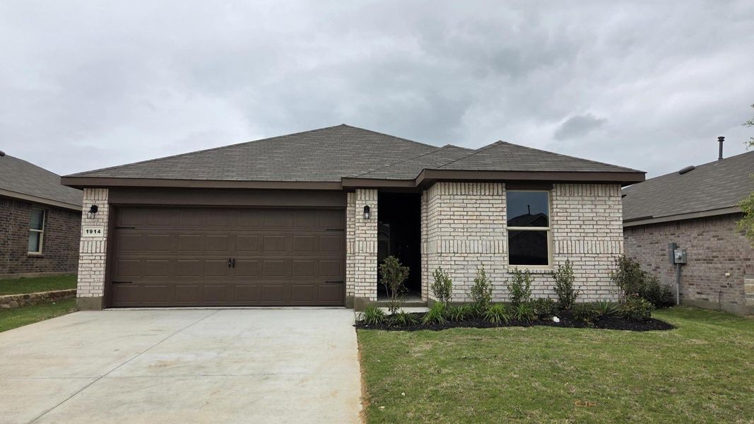 Front exterior of a new home in Legado, Cleburne, TX, highlighting curb appeal (Image 1). Front exterior of a new home in Legado, Cleburne, TX, highlighting curb appeal (Image 1).