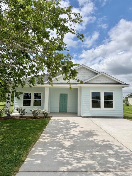 Front exterior of a new home in , Palacios, TX, highlighting curb appeal (Image 13). Front exterior of a new home in , Palacios, TX, highlighting curb appeal (Image 13).