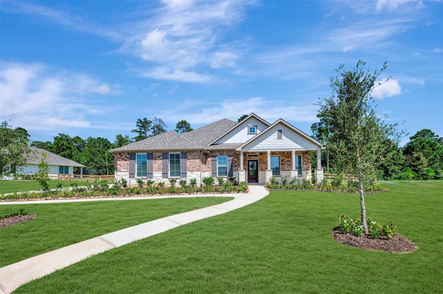 Front exterior of a new home in Lone Star Landing, Montgomery, TX, highlighting curb appeal (Image 1). Front exterior of a new home in Lone Star Landing, Montgomery, TX, highlighting curb appeal (Image 1).