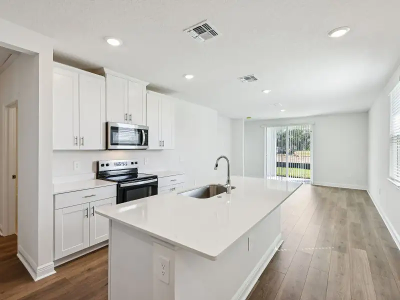 Furnished interior view inside a new home in Villamar - Classic Series, Winter Haven (Image 3).