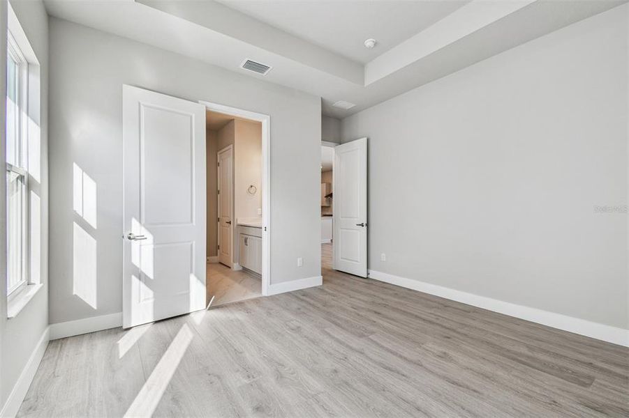 Spacious, unfurnished interior of a new home in Emerald Landing at Waterside at Lakewood Ranch – Cottage Series, Sarasota (Image 30). Spacious, unfurnished interior of a new home in Emerald Landing at Waterside at Lakewood Ranch – Cottage Series, Sarasota (Image 30).