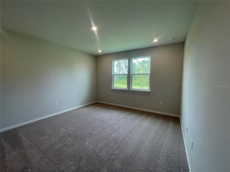 Spacious, unfurnished interior of a new home in Magnolia Series at Seminole Palms, Palm Coast (Image 18).