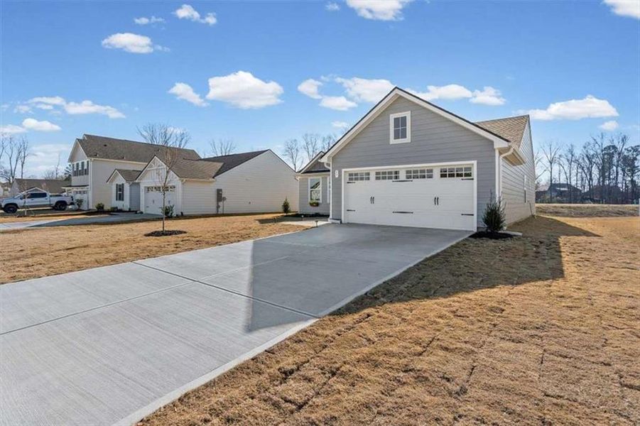 Front exterior of a new home in , Rome, GA, highlighting curb appeal (Image 23). Front exterior of a new home in , Rome, GA, highlighting curb appeal (Image 23).