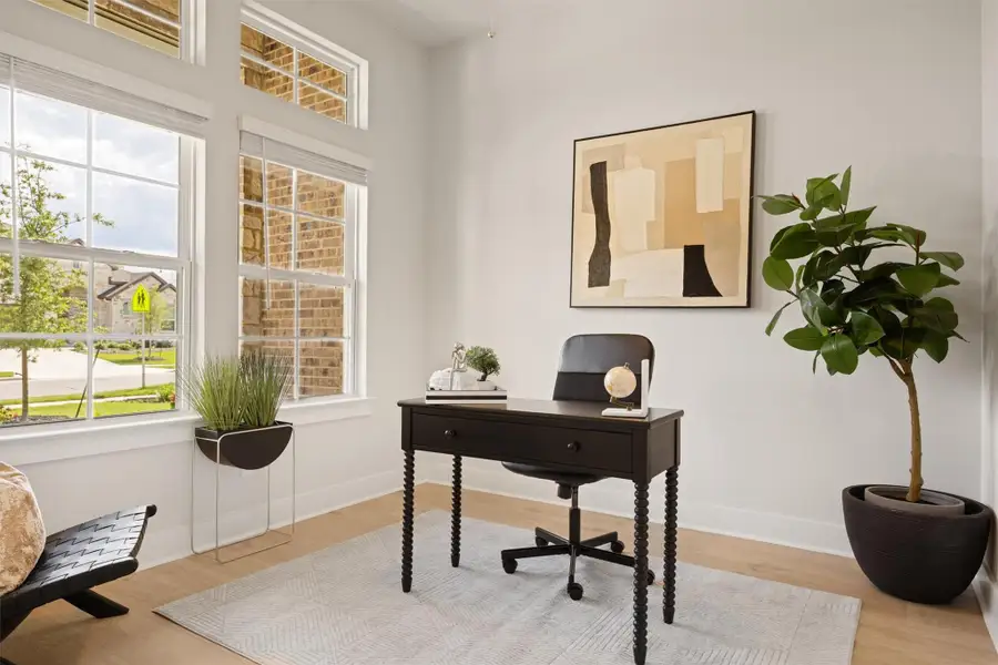 Office area featuring healthy amount of natural light and wood finished floors Office area featuring healthy amount of natural light and wood finished floors