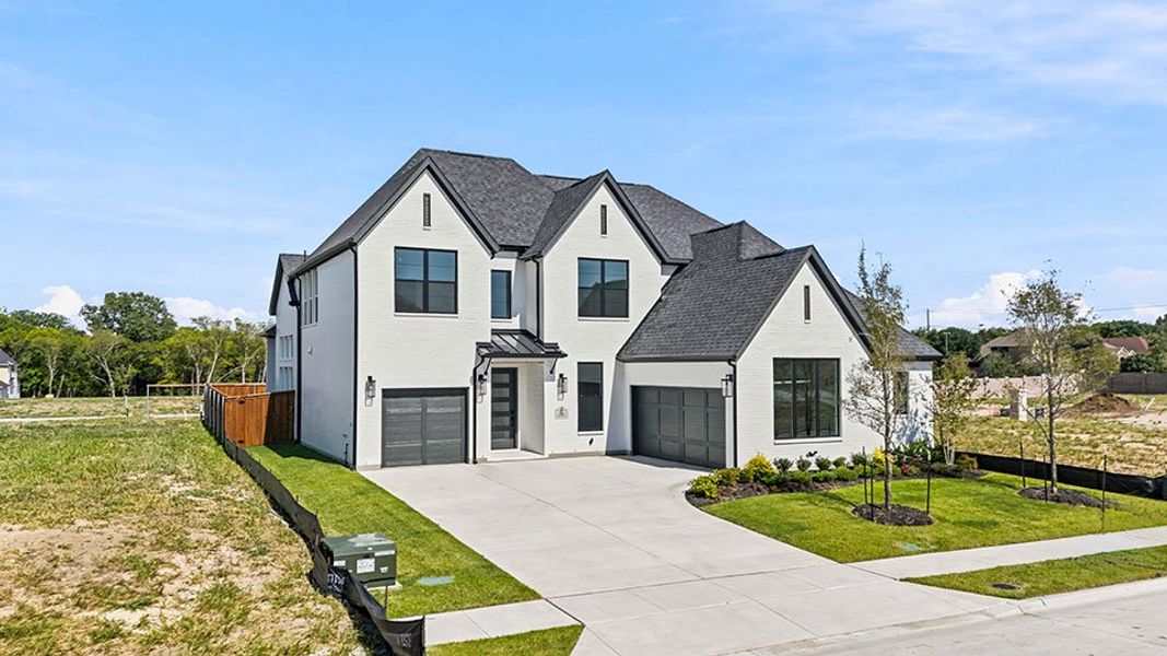 Front exterior of a new home in Custer Ridge Estates, Allen, TX, highlighting curb appeal (Image 27).
