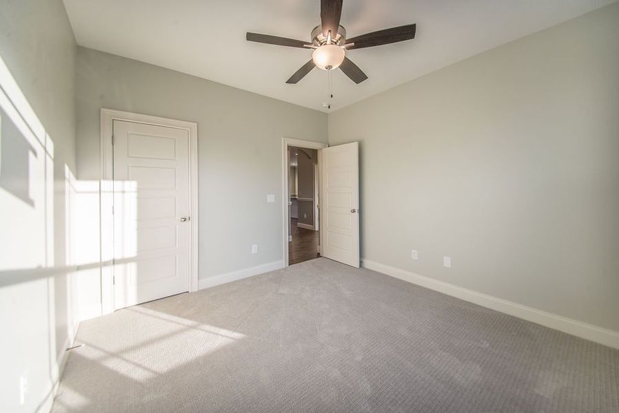 Representative unfurnished interior of a home built from the Mediterranean by Enchanted Homes in Messer Farms, Inman (Image 23).