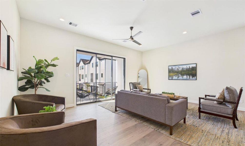 Discover the beautiful open concept style 2nd floor living room leading to the large balcony