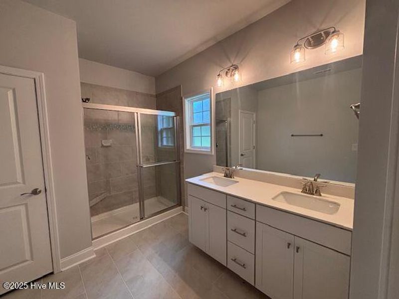 Furnished interior view inside a new home in River Village Square in River Landing, Wallace (Image 8).