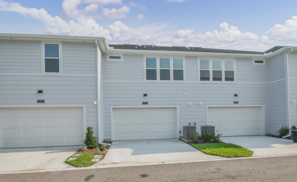 Front exterior of a new home in Nocatee, Ponte Vedra, FL, highlighting curb appeal (Image 2).
