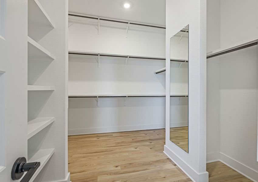 The walk-in closet in the master suite has plenty of haning and shelf space.