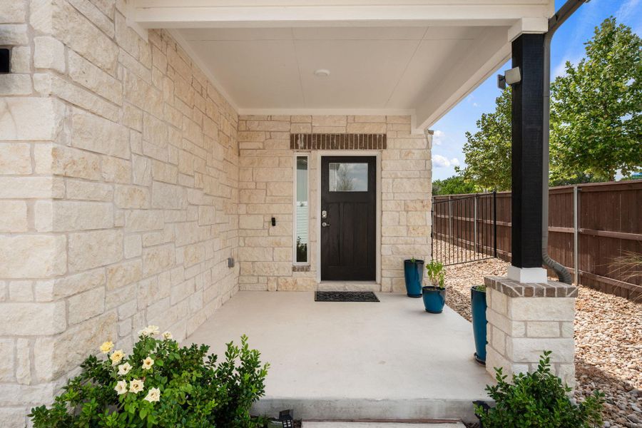 Exterior details and patio area of a home in Messinger Village, Austin (Image 4).