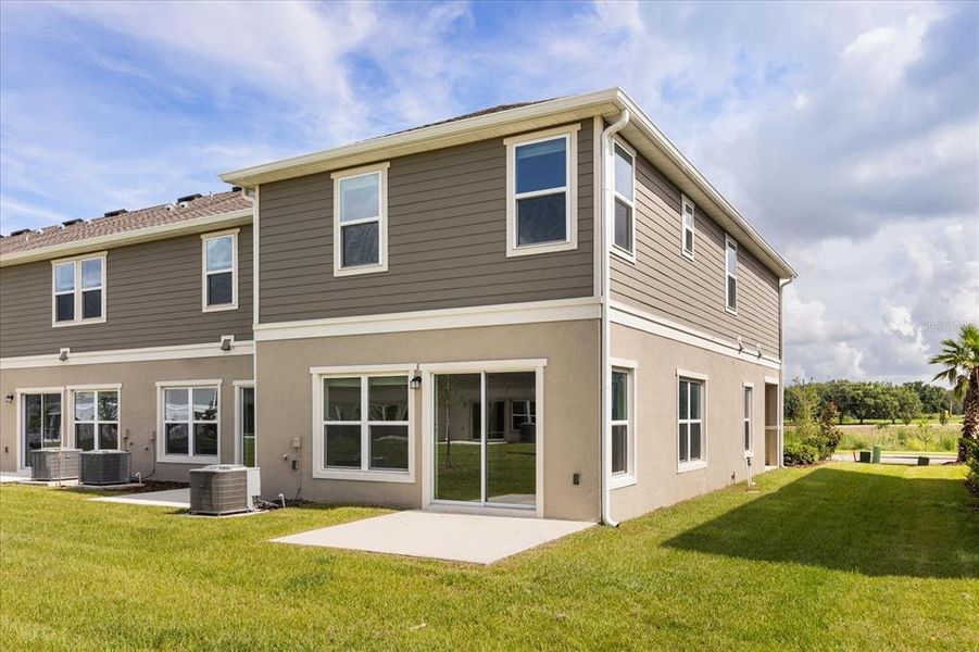 Front exterior of a new home in Reserve at Forest Lake Townhomes, Lake Wales, FL, highlighting curb appeal (Image 18). Front exterior of a new home in Reserve at Forest Lake Townhomes, Lake Wales, FL, highlighting curb appeal (Image 18).