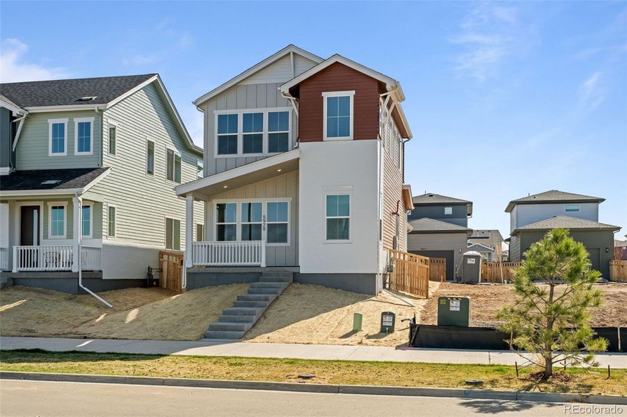 Front exterior of a new home in Painted Prairie, Aurora, CO, highlighting curb appeal (Image 28).