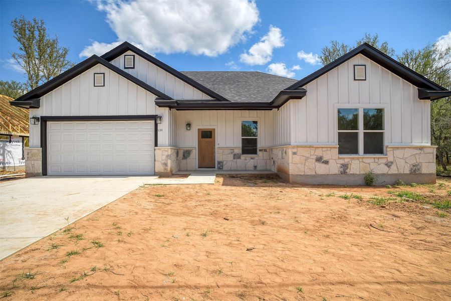 Front exterior of a new home in , Bastrop, TX, highlighting curb appeal (Image 19).