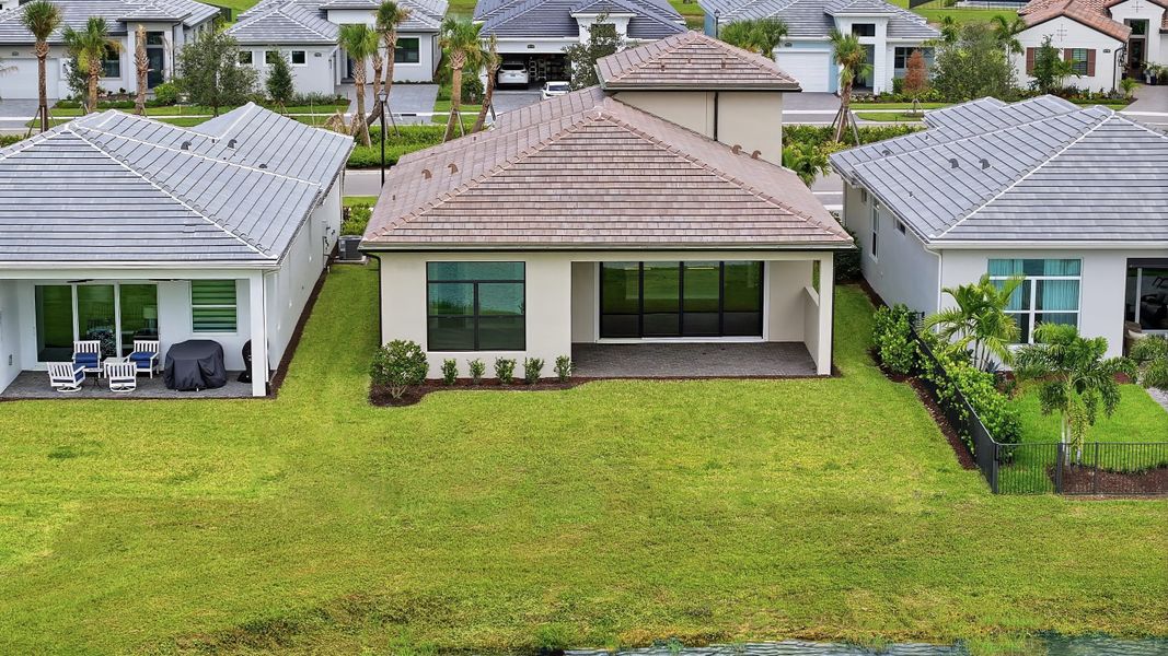 Exterior details and patio area of a home in PGA Village Verano, Port St. Lucie (Image 24).