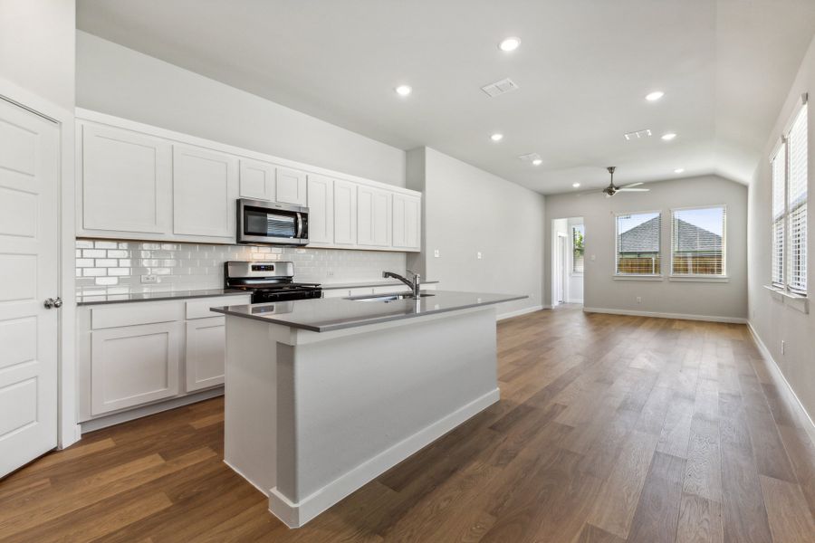 Kitchen in the Cedar home plan by Trophy Signature Homes – REPRESENTATIVE PHOTO