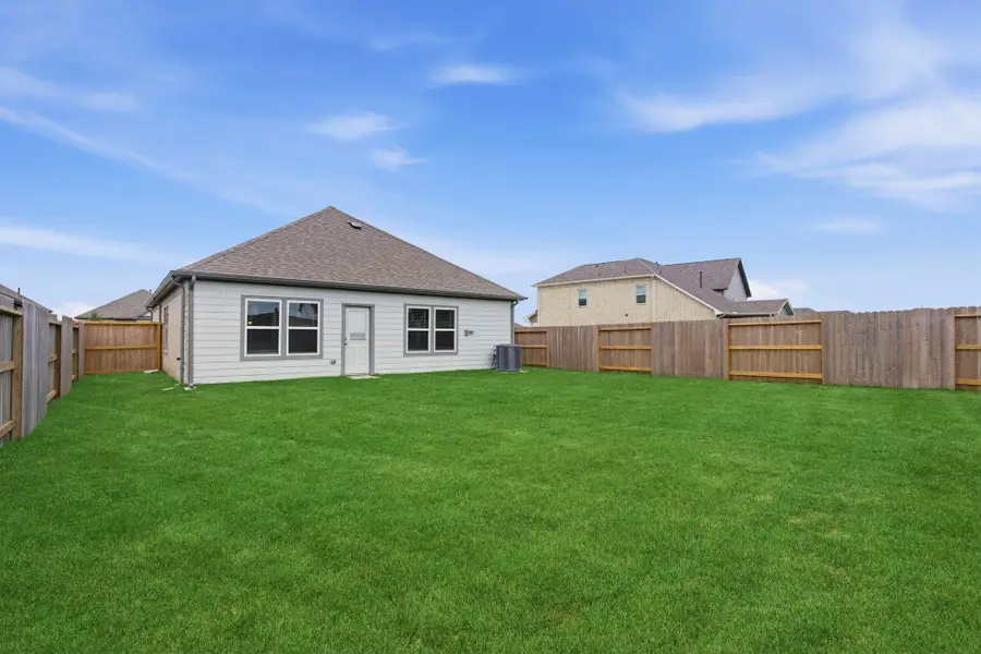 Exterior details and patio area of a home in Creekhaven, Iowa Colony (Image 23). Exterior details and patio area of a home in Creekhaven, Iowa Colony (Image 23).