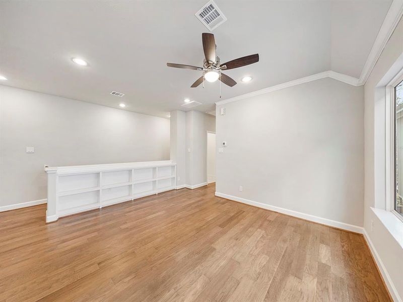 A fantastic space, this game room can serve as an informal media room or a home gym, or both. It has built-in shelves for extra storage and carpet floors, all part of our Standard Features. (Sample photos of a completed Chesapeake floor plan. The image may feature alternative selections and/or upgrades.)