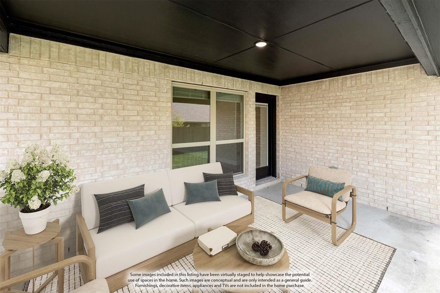 Covered patio with light brick walls, outdoor sofa, chair, and coffee table on a woven rug