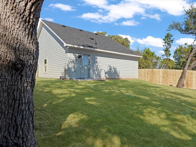 Rear view of house featuring roof with shingles Rear view of house featuring roof with shingles