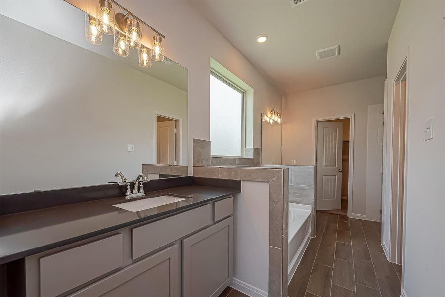 Furnished interior view inside a new home in Enclave At Dobbin, Magnolia (Image 18).