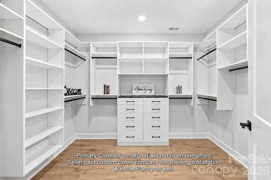 Wow! Main Bedroom closet is so large can't show it all in this photo. Custom built ins & shelving.
