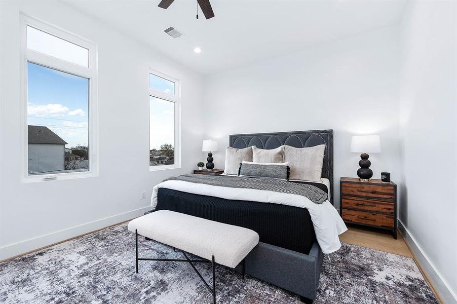 Large Primary bedroom with those large windows.