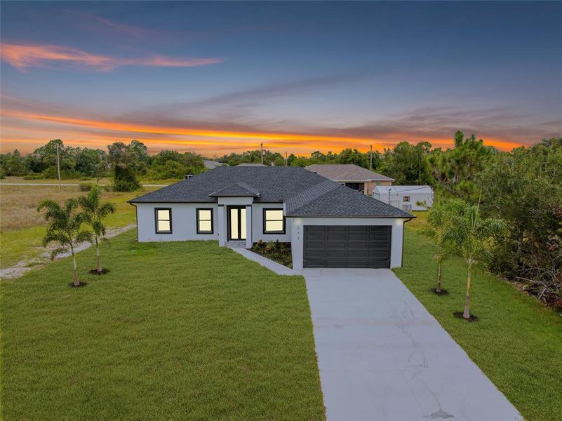 Front exterior of a new home in , Lehigh Acres, FL, highlighting curb appeal (Image 20). Front exterior of a new home in , Lehigh Acres, FL, highlighting curb appeal (Image 20).