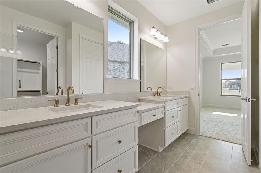 Double sinks and a vanity area.