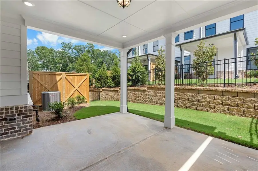 Exterior details and patio area of a home in Millcroft Townhomes, Buford (Image 29).