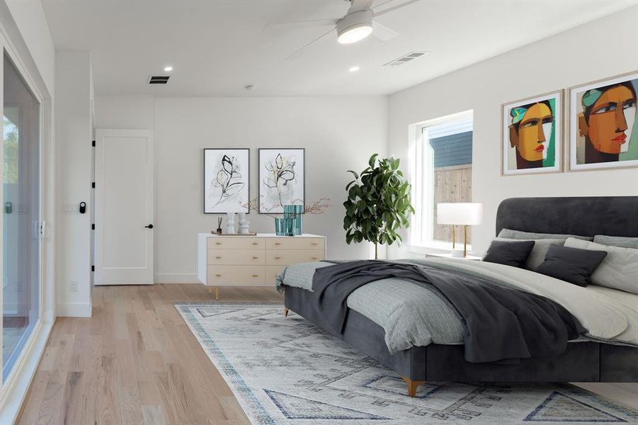 Bedroom featuring light hardwood / wood-style floors, multiple windows, and ceiling fan