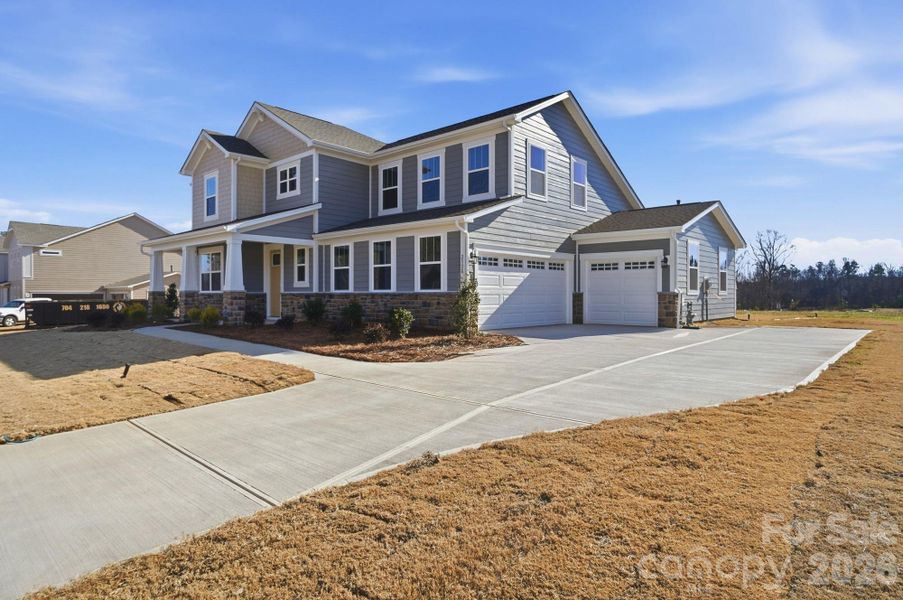 Front exterior of a new home in Blair Place, Monroe, NC, highlighting curb appeal (Image 2).