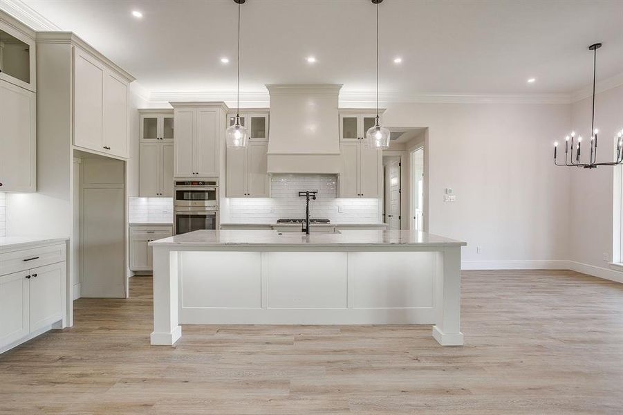 Oversized counter height island with LED lighting.