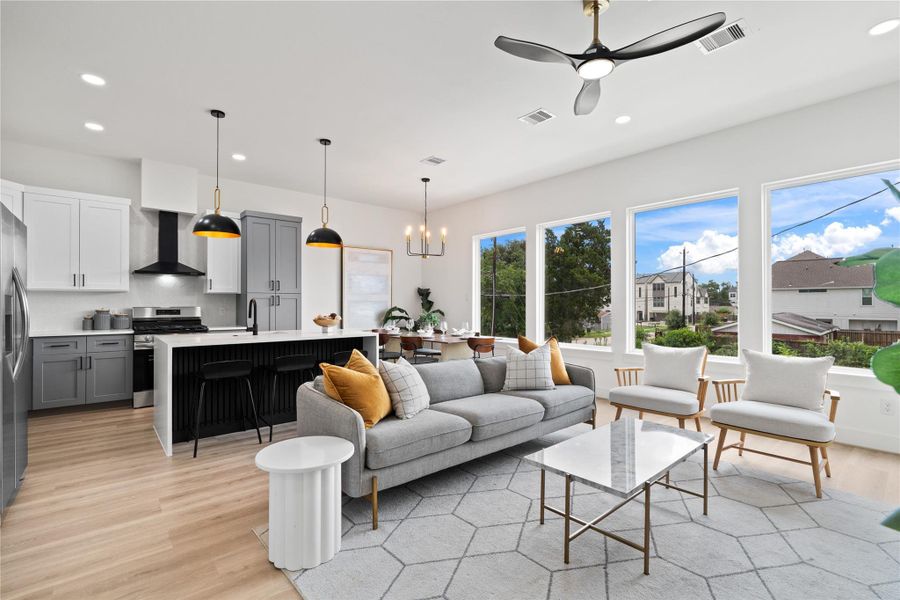 Designed for connection, thisliving area flows seamlessly intothe kitchen and dining, framedby a modern neutral palette andwarm LVP floors