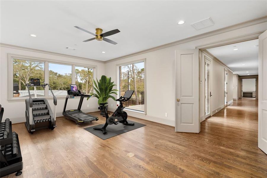 Enjoy a workout with a view in the second-floor exercise room featuring oversized windows overlooking the northern balcony.